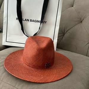 Ruslan Baginskiy straw hat woven fedora logo